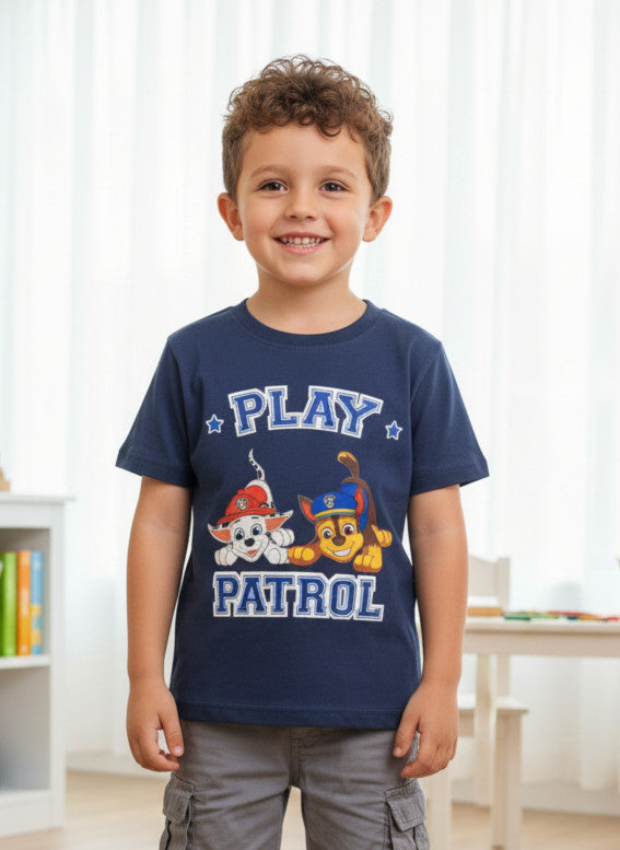 Child wearing a navy blue 'Play Patrol' t-shirt with cartoon characters indoors.
