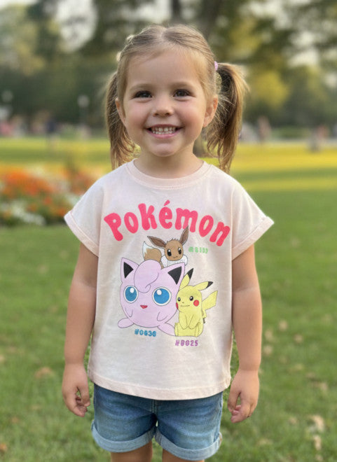 Child wearing a Pokémon t-shirt in a park setting